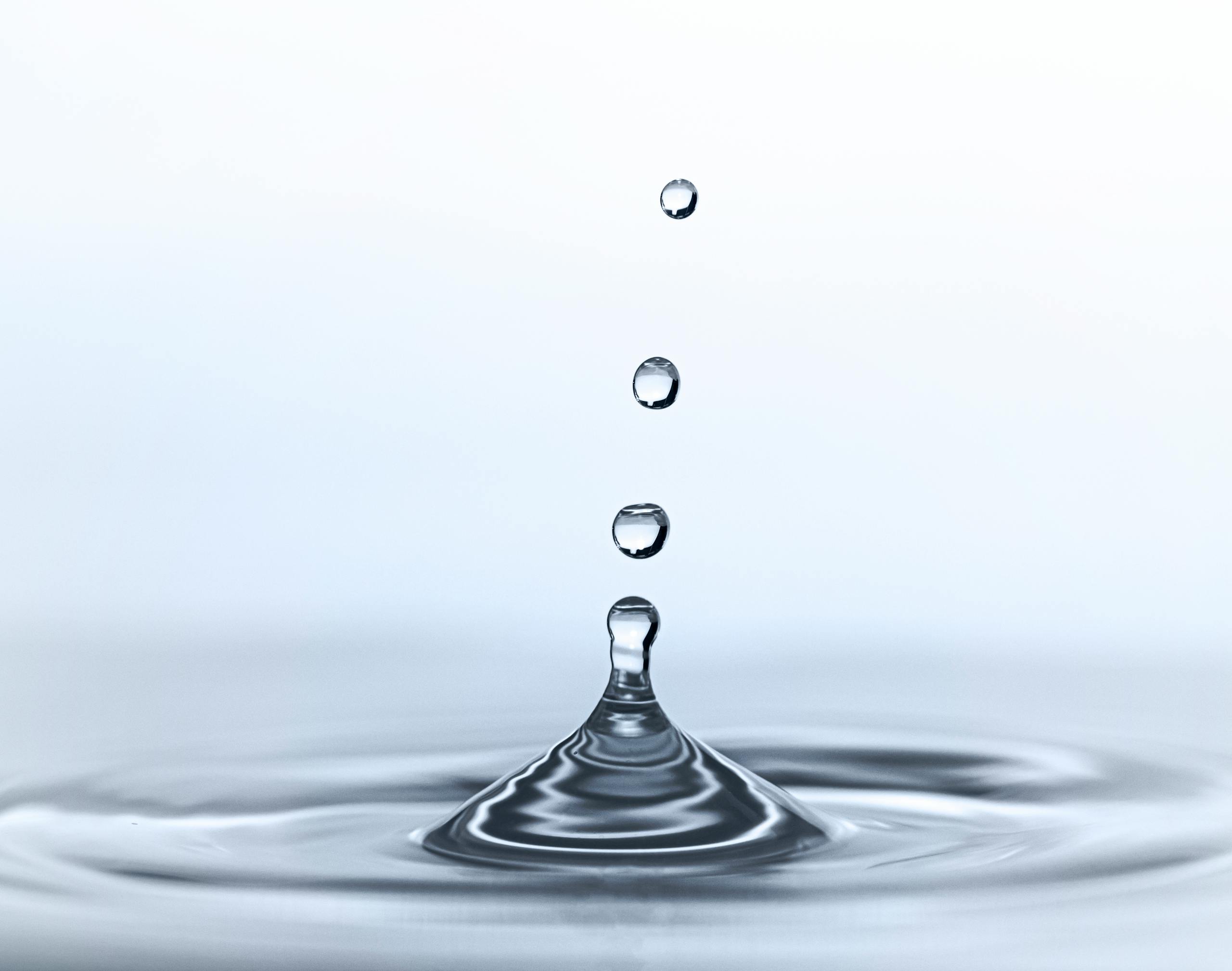 Captivating image of water droplets in motion, showcasing purity and clarity.